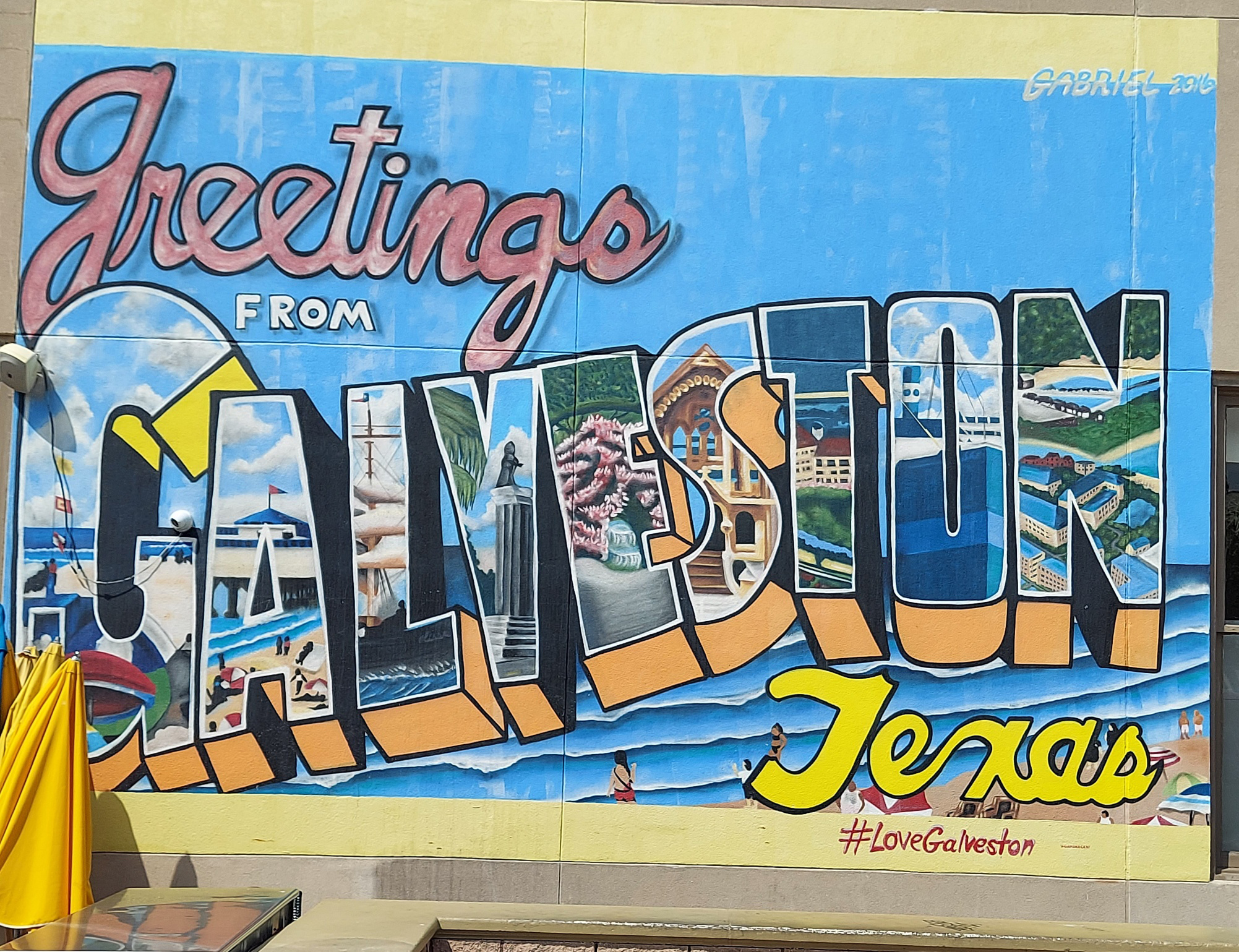  Iconic 'Greetings from Galveston, Texas' Sign Adorning Yaga's Restaurant, a Coastal Landmark with Vibrant Colors and Vintage Charm
